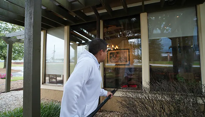 Cleaning outside windows for a business